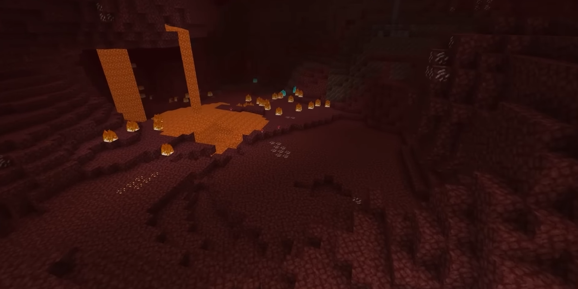 Lava falls feeding a pool surrounded by burning netherrack in Minecraft's Nether