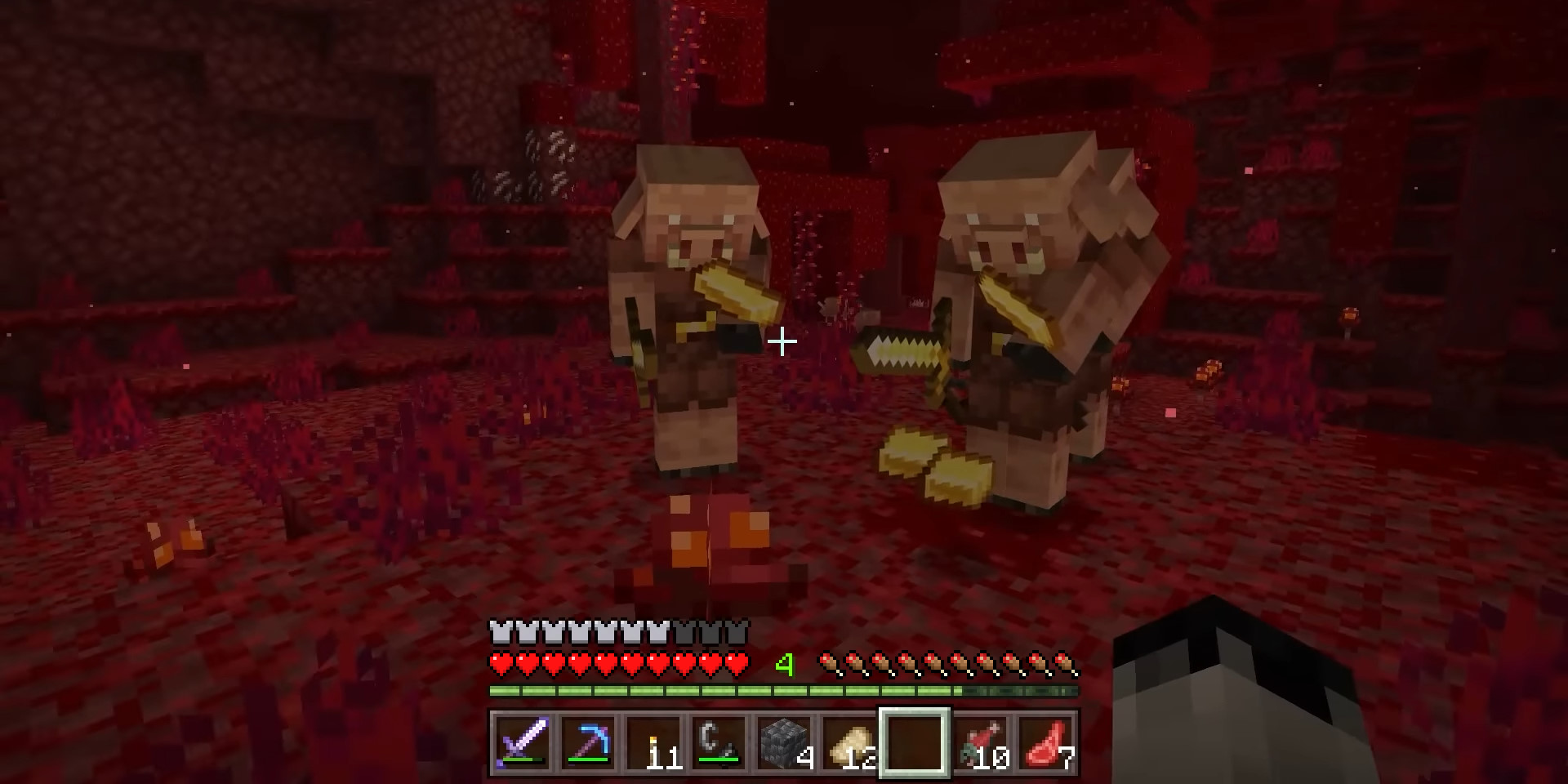 Two sword-carrying piglins examining gold ingots in a Minecraft crimson forest